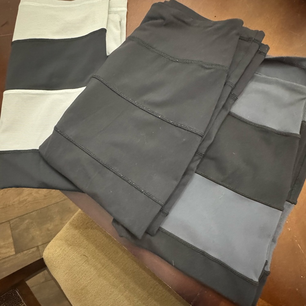 Lot of 3 lululemon Black and Gray , blue and white stripe , and black midi Skirt